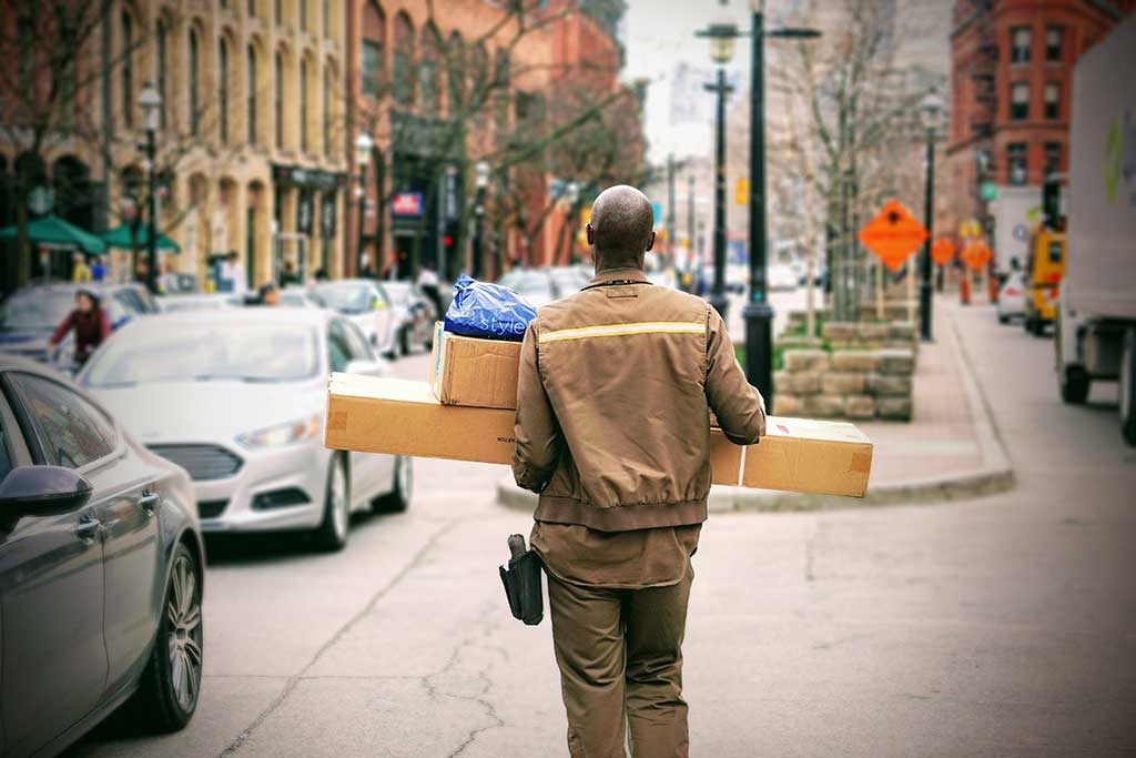 delivery man Photo by Maarten van den Heuvel on Unsplash